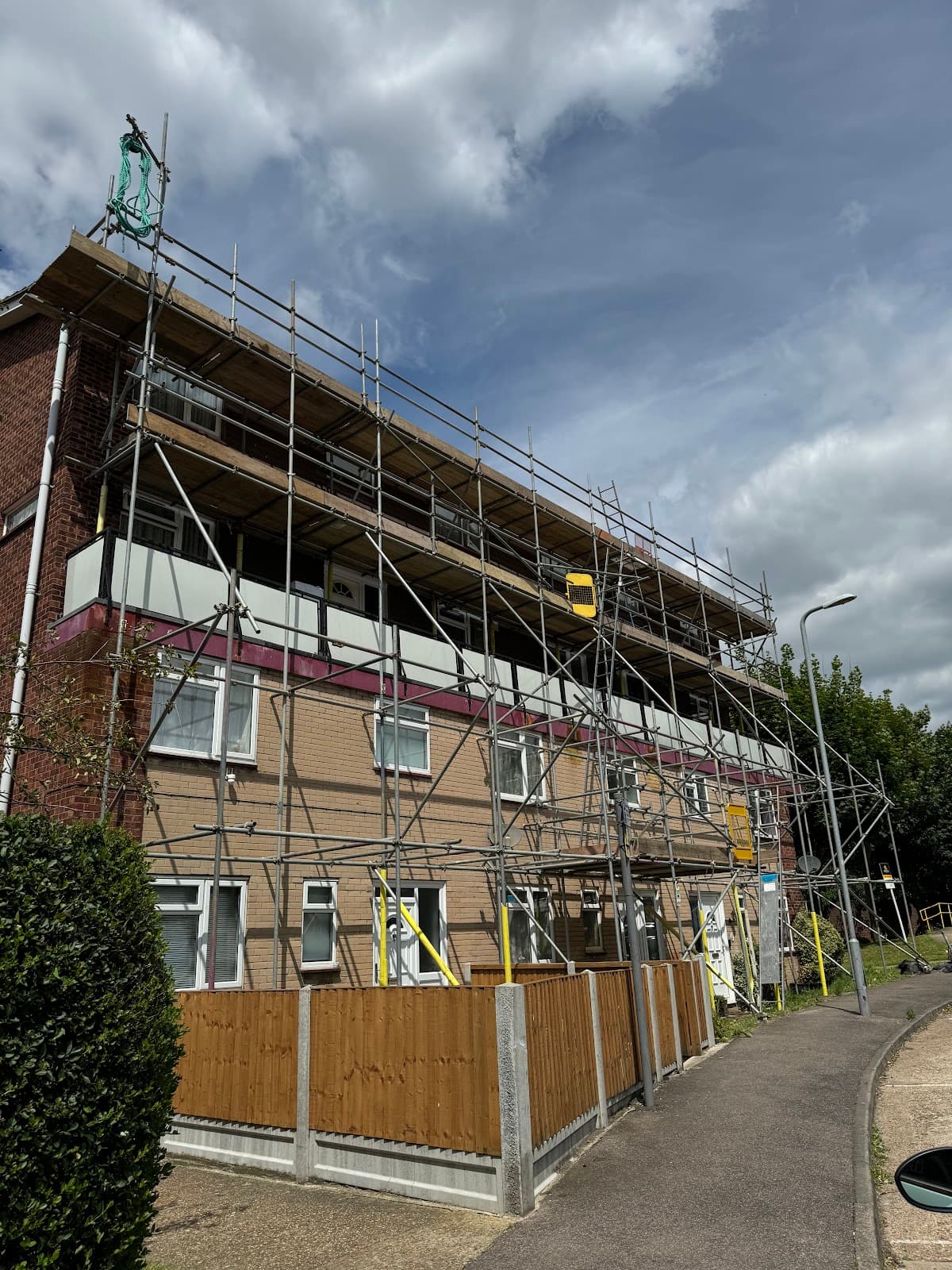 Scaffolding erected around a building undergoing exterior renovation